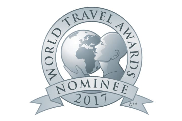 World Travel Awards Nominee 2017 silver logo featuring a figure holding a globe, with text on a circular band and a ribbon.